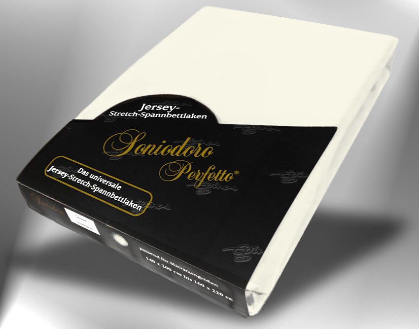 EGINO cream jersey knit stretch sheet (22-Cream) in retail packaging, under dim light