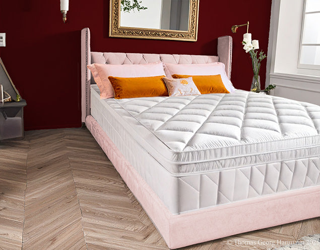 Bare extra deep Queen-size mattress before fitting the stretch jersey knit fitted sheet.