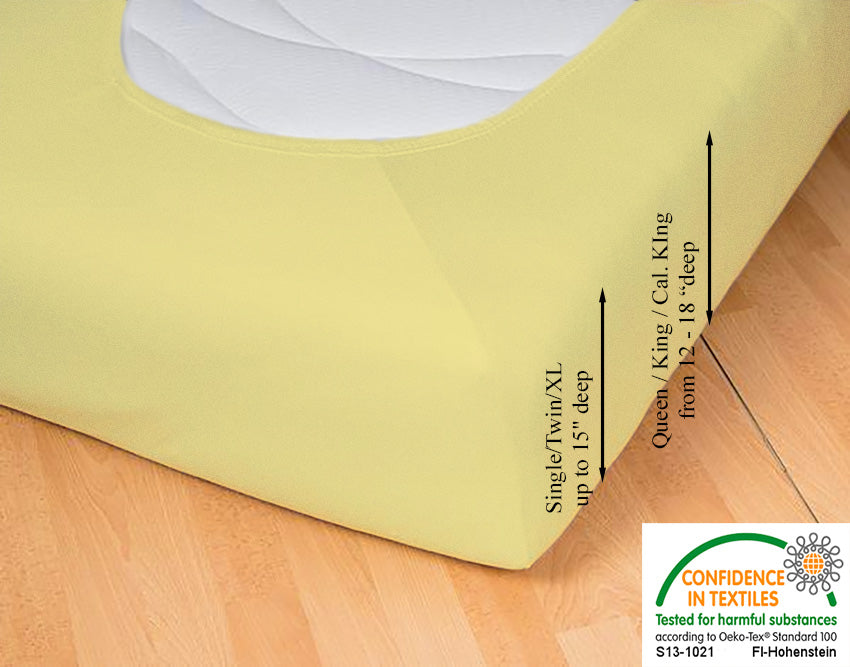 Fitted jersey knit stretch sheet in color 24-sun, underside showing characteristic oval bottom hugging mattress, deep pocket up to 18 in, OEKO-TEX certified – Egino.