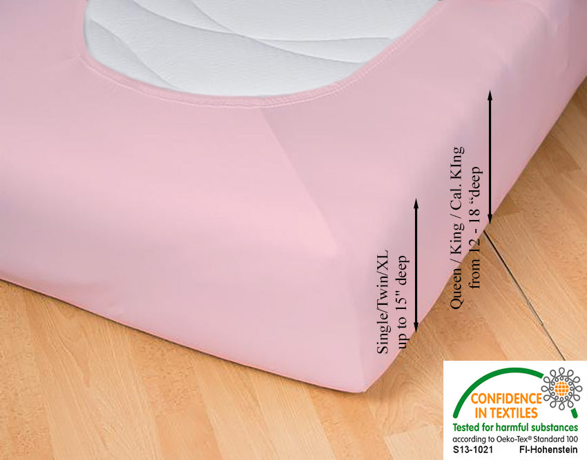 Fitted jersey knit stretch sheet in color 34-rosé, underside showing characteristic oval bottom hugging mattress, deep pocket up to 18 in, OEKO-TEX certified – Egino.