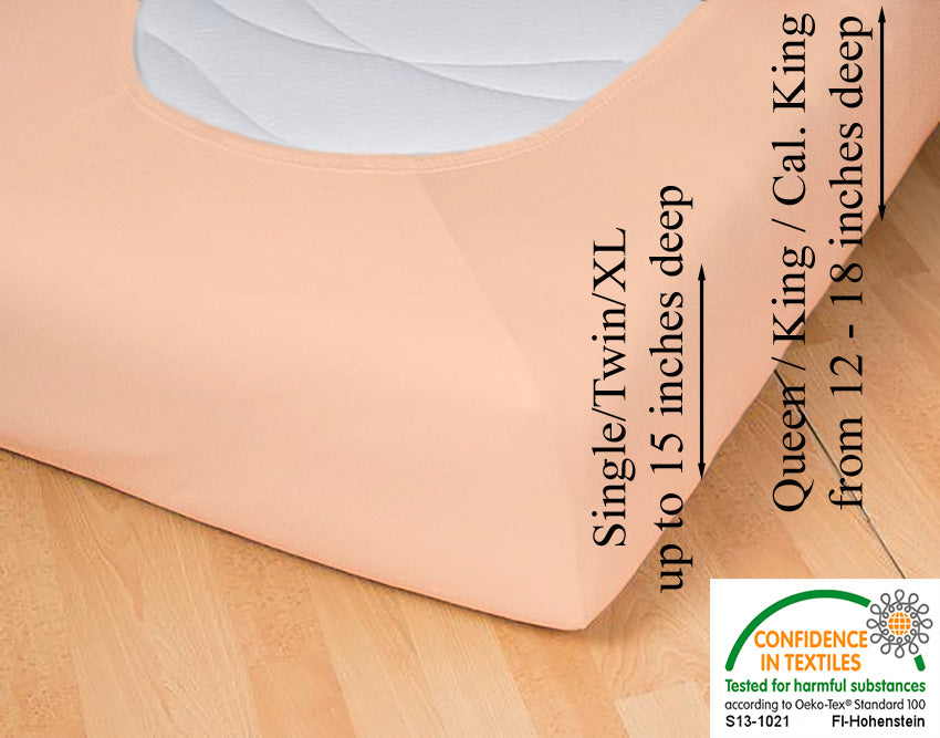 Fitted jersey knit stretch sheet in color 49-apricot, underside showing characteristic oval bottom hugging mattress, deep pocket up to 18 in, OEKO-TEX certified – Egino.