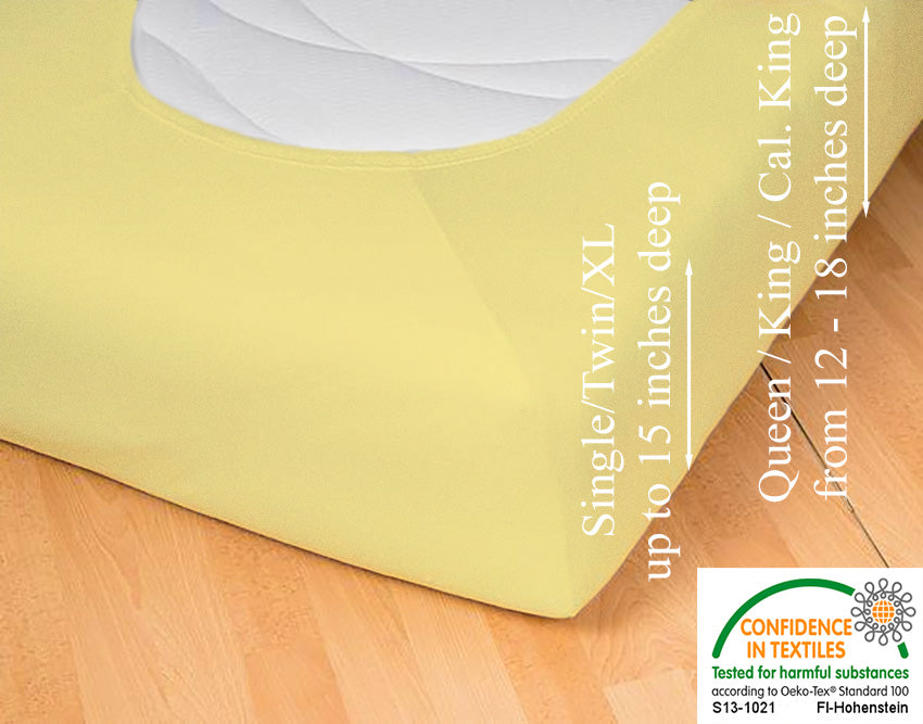 Fitted jersey knit stretch sheet in color 24-sun, underside showing characteristic oval bottom hugging mattress, deep pocket up to 18 in, OEKO-TEX certified – Egino.