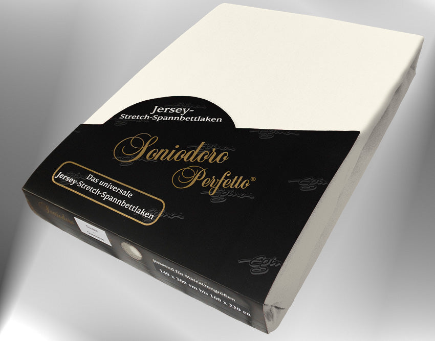 EGINO cream jersey knit stretch sheet (22-Cream) in retail packaging, under dim light