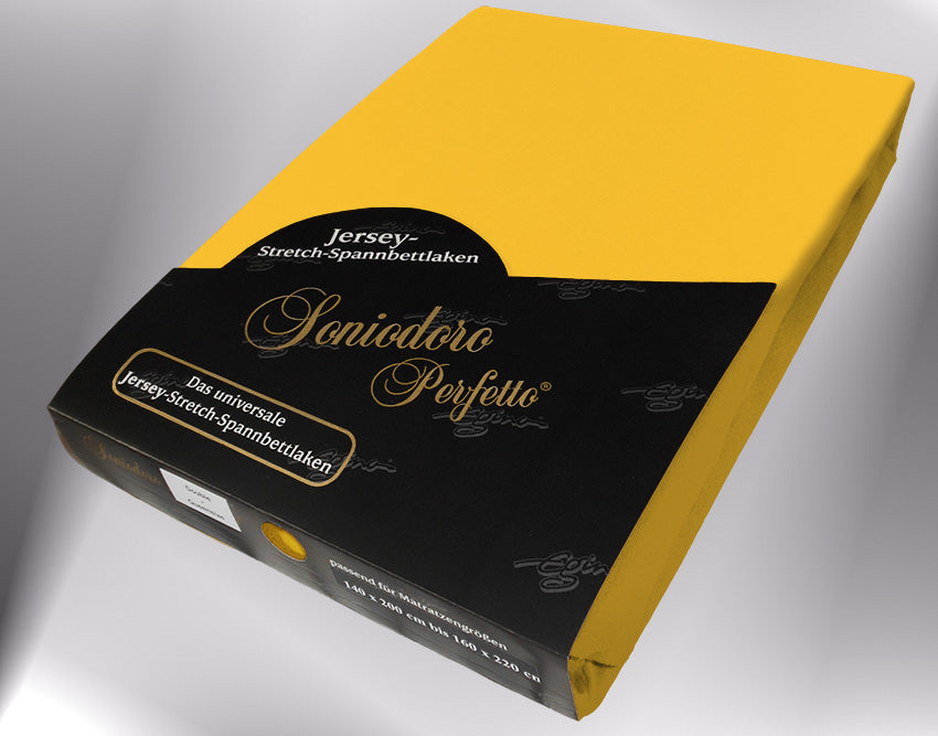 EGINO gold jersey knit stretch sheet (67-Gold) in retail packaging, under dim light