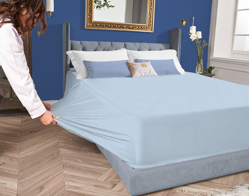 Bleu 96/4 jersey-knit fitted sheet on an extra-deep mattress—pulling the sidewall over a foot outward. This abundant stretch ensures an effortless change for those with limited mobility. Partners flawlessly with navy, silver, or graphite.