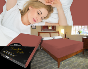 Person sleeping undisturbed on deep adjustable bed with Egino Jersey knit stretch sheet in color 55-redwood