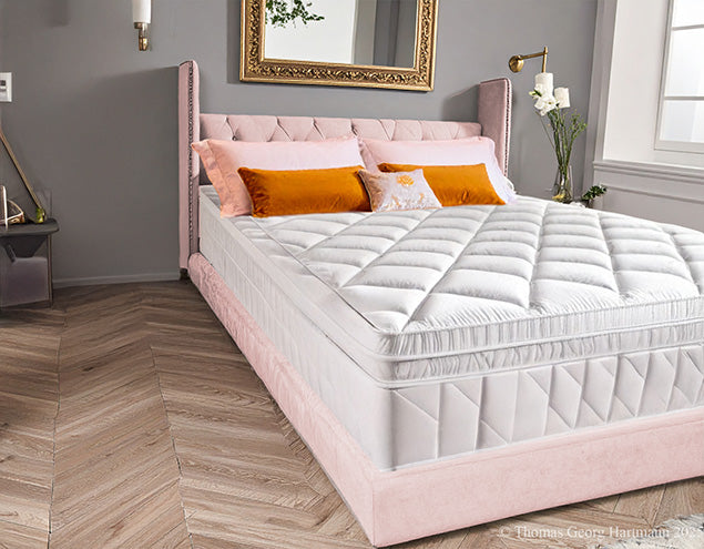 “Bare extra deep Queen-size mattress before fitting the stretch jersey knit fitted sheet (silver).