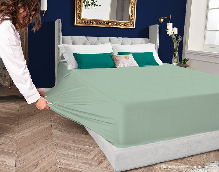 Bluegrass 96/4 jersey-knit sheet on a deep mattress—pulling the sidewall over a foot outward for a quick change. This serene hue settles the room and pairs naturally with neutral wood hues or blush pastels for a tranquil aesthetic.