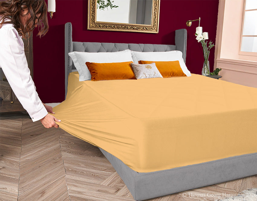 Caramel 96/4 jersey-knit sheet on a deep mattress—pulling the sidewall over a foot outward. This abundant stretch ensures an effortless change. Pair with bordeaux or graphite for a decadent and grounding bedroom feel.