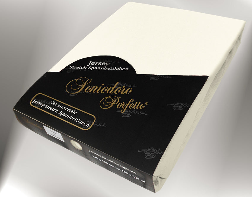 EGINO cream jersey knit stretch sheet (22-Cream) in retail packaging, under dim light