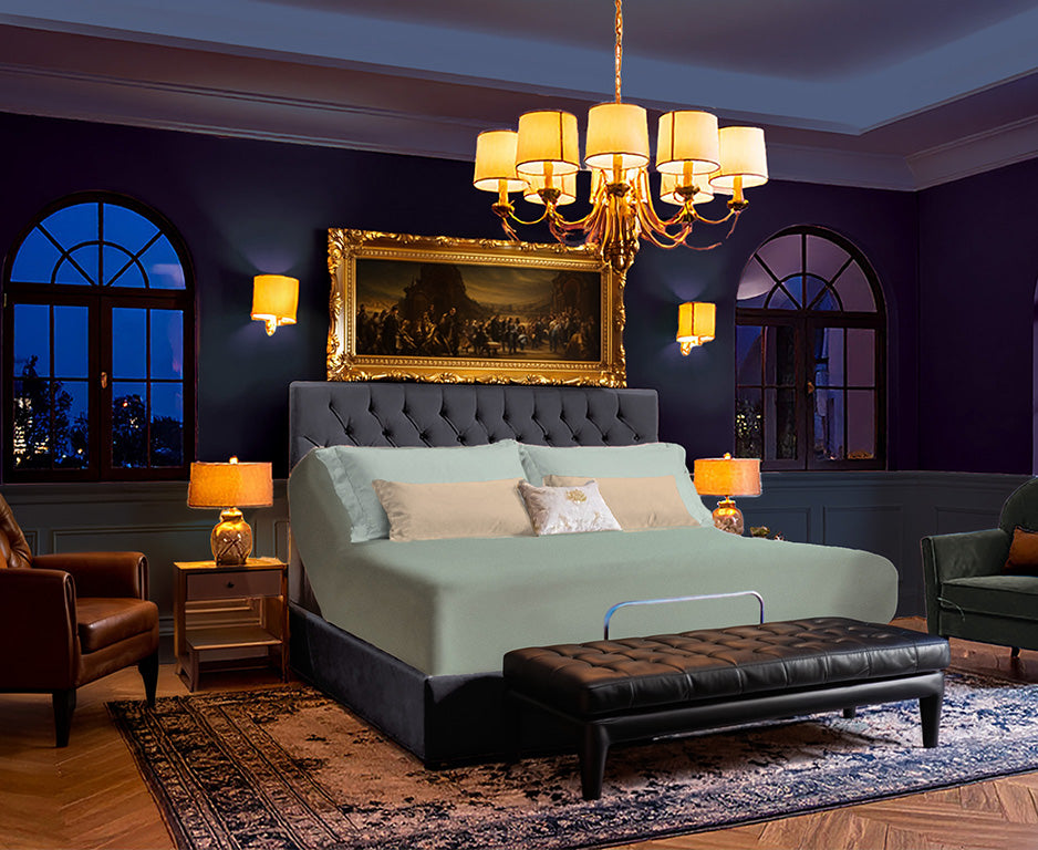 EGINO Bluegrass jersey stretch sheet fitted to an 18-inch adjustable bed in a moody, modern masculine bedroom with arched city-view windows