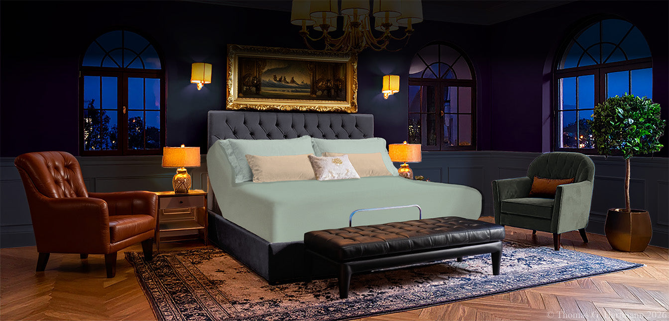EGINO Bluegrass jersey stretch sheet fitted to an 18-inch adjustable bed in a moody, modern masculine bedroom with arched city-view windows
