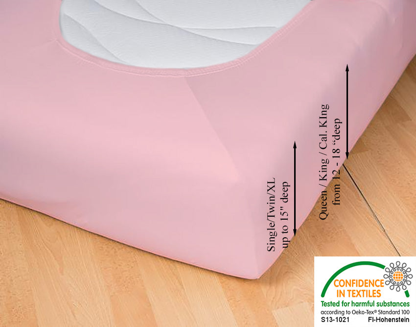 Fitted jersey knit stretch sheet in color 34-rosé, underside showing characteristic oval bottom hugging mattress, deep pocket up to 18 in, OEKO-TEX certified – Egino.