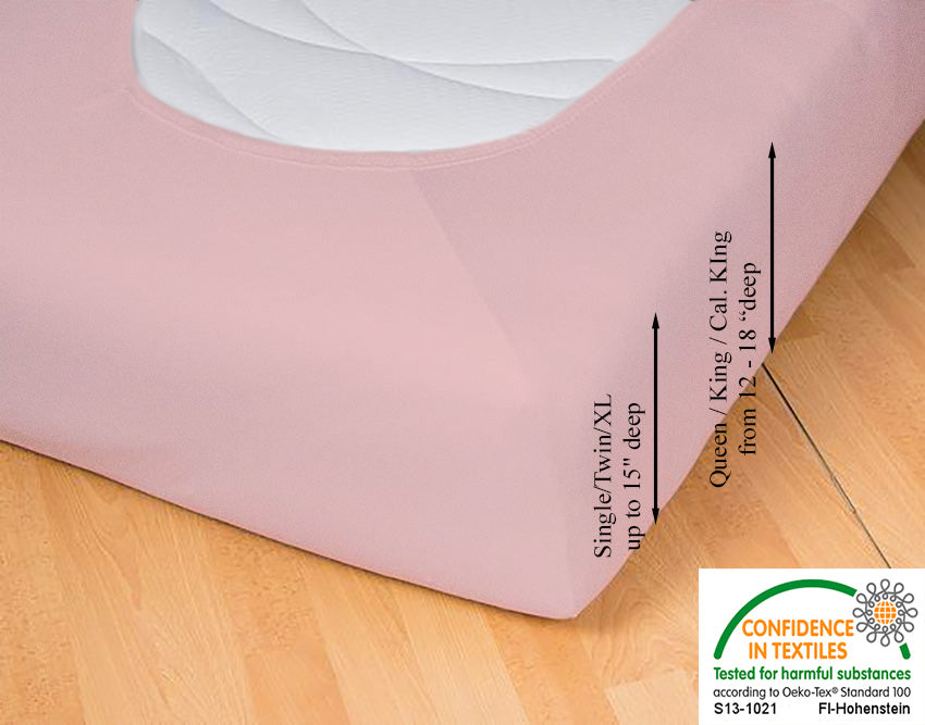 Fitted jersey knit stretch sheet in color 34-rosé, underside showing characteristic oval bottom hugging mattress, deep pocket up to 18 in, OEKO-TEX certified – Egino.