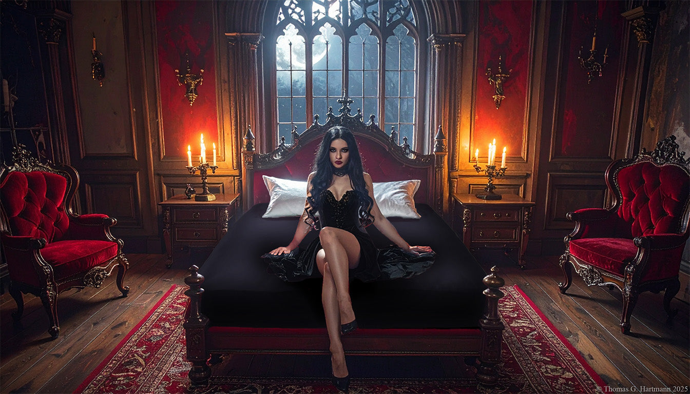 Black jersey-knit stretch fitted sheet on an extra-deep mattress — gothic woman in black dress sits in a moonlit castle bedroom.