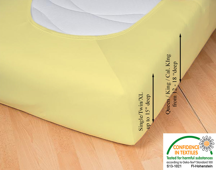 Fitted jersey knit stretch sheet in color 24-sun, underside showing characteristic oval bottom hugging mattress, deep pocket up to 18 in, OEKO-TEX certified – Egino.