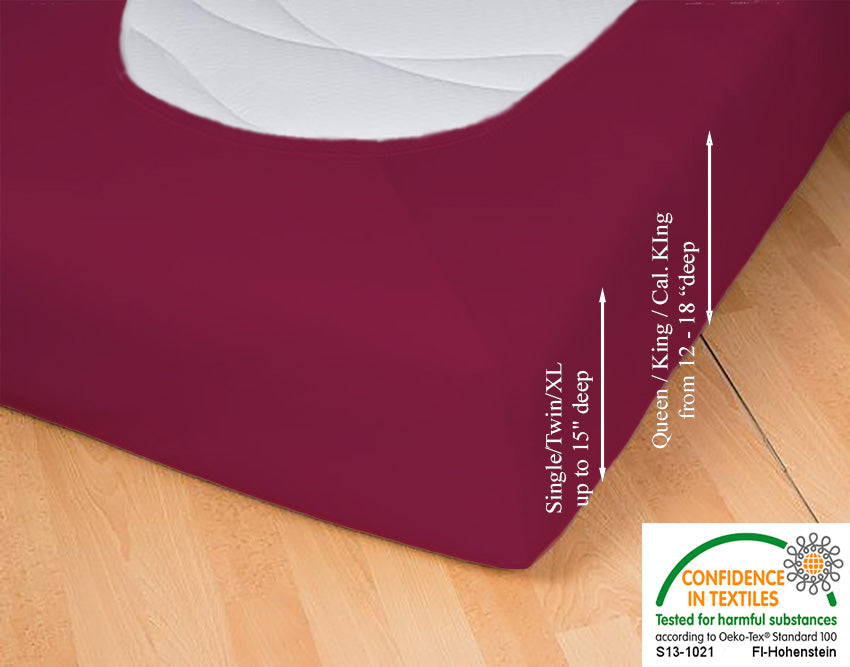 Fitted jersey knit stretch sheet in color 56-bordeaux, underside showing characteristic oval bottom hugging mattress, deep pocket up to 18 in, OEKO-TEX certified – Egino.