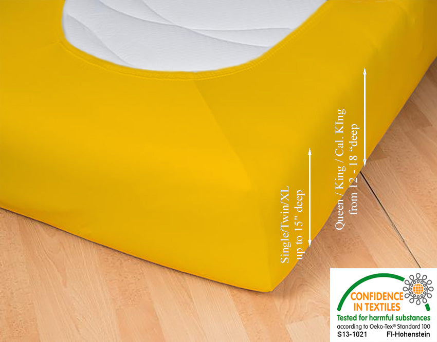 Fitted jersey knit stretch sheet in color 67-gold, underside showing characteristic oval bottom hugging mattress, deep pocket up to 18 in, OEKO-TEX certified – Egino.