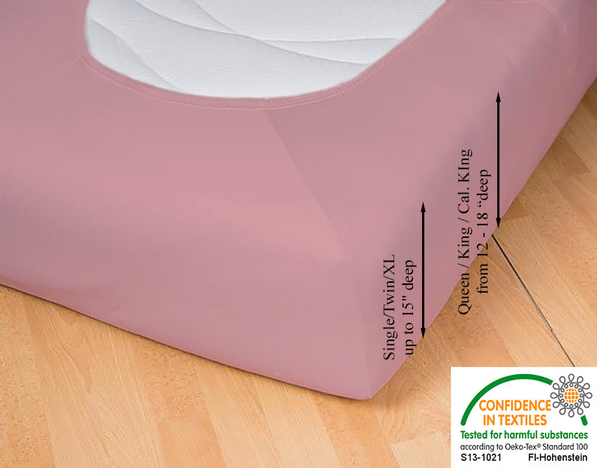 Fitted jersey knit stretch sheet in color 35-old-rose, underside showing characteristic oval bottom hugging mattress, deep pocket up to 18 in, OEKO-TEX certified – Egino.