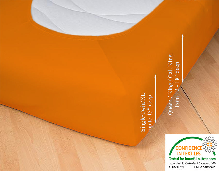 Fitted jersey knit stretch sheet in color 50-orange, underside showing characteristic oval bottom hugging mattress, deep pocket up to 18 in, OEKO-TEX certified – Egino.
