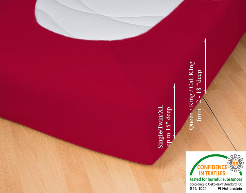 Fitted jersey knit stretch sheet in color 37-red, underside showing characteristic oval bottom hugging mattress, deep pocket up to 18 in, OEKO-TEX certified – Egino.