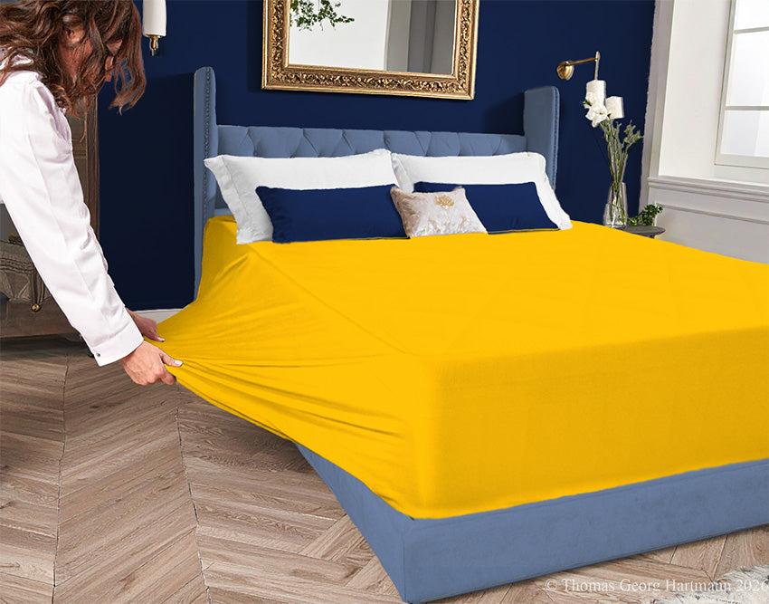 Gold 96/4 jersey-knit sheet on a deep mattress—pulling the sidewall over a foot outward for a quick change. Pairs with burgundy or black to shift its festival flair into a richly elegant and dramatic bedroom aesthetic.