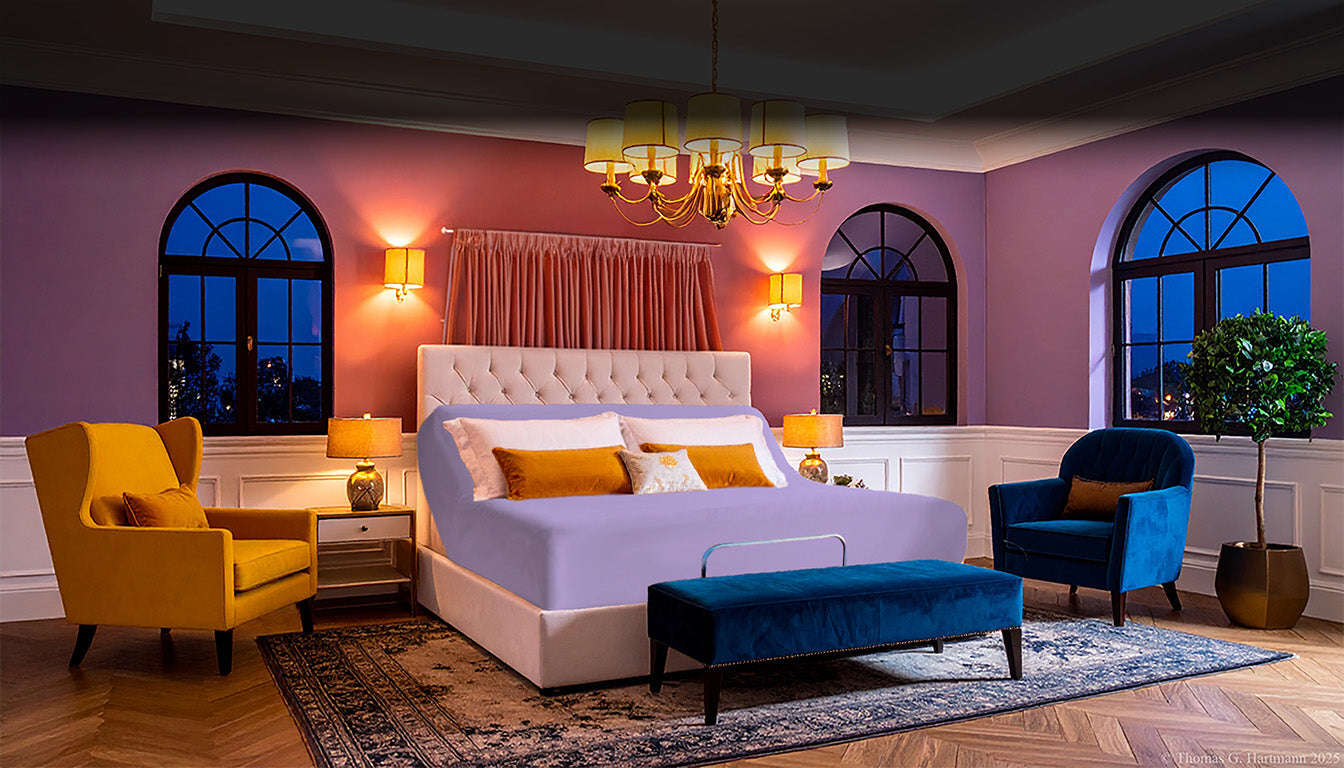 Jersey knit stretch fitted sheet on an adjustable bed, sized for up to 18-inch deep mattresses in a modern, fashion-forward bedroom.