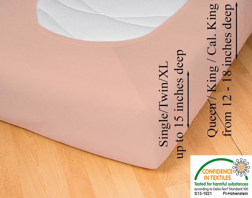 Fitted jersey knit stretch sheet in color 49-apricot, underside showing characteristic oval bottom hugging mattress, deep pocket up to 18 in, OEKO-TEX certified – Egino.