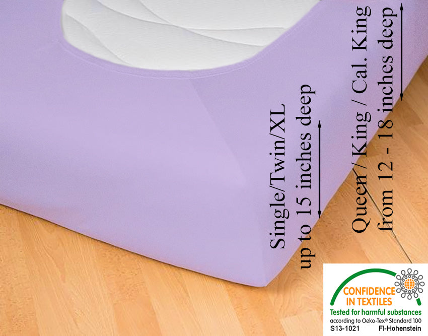 Fitted jersey knit stretch sheet in color 46-lilac, underside showing characteristic oval bottom, hugging mattress, deep pocket up to 18 inches deep, OEKO-TEX certified – Egino.