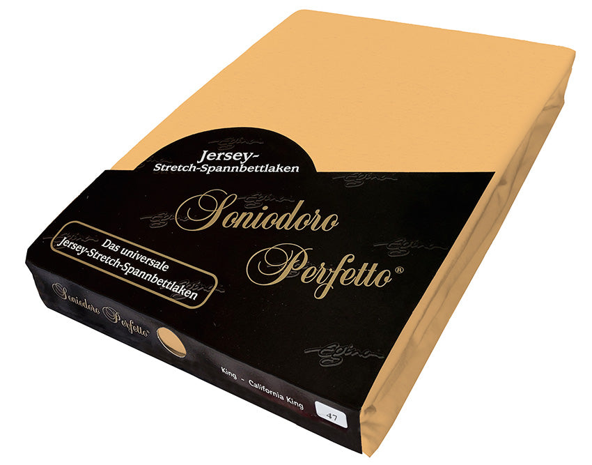 EGINO Caramel jersey-knit stretch sheet in original German packaging. A 96/4 wellness essential with a refined, golden-brown glow like bronzed butter and sugar—softly elegant, cozy, and deeply sophisticated.