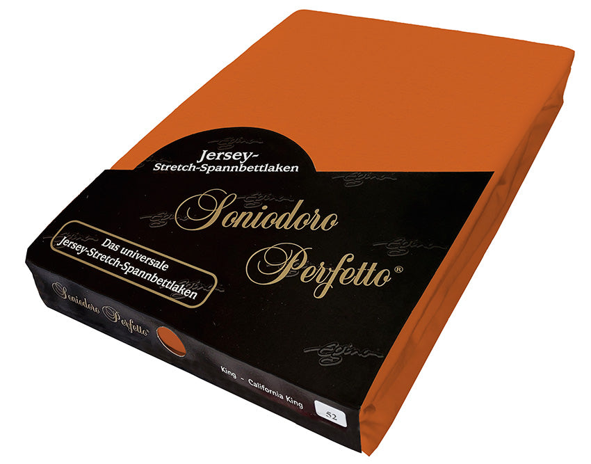 EGINO Terracotta jersey-knit stretch sheet in original German packaging. A 96/4 wellness essential in earthen burnt-orange that channels sun-baked earth and spice-route adventure—a bold yet grounded bedroom foundation.