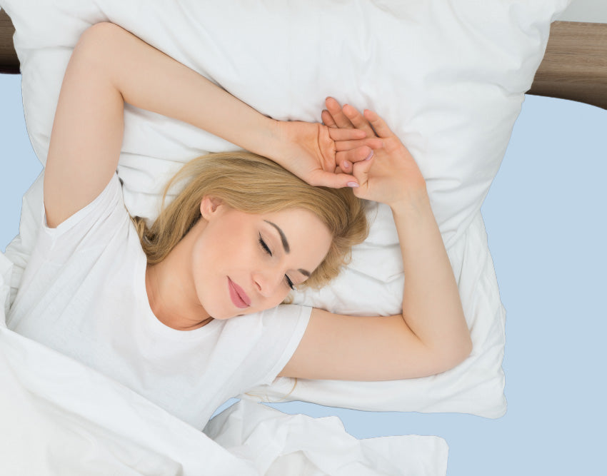 A peaceful, deep sleep on an EGINO bleu jersey knit stretch fitted sheet, showcasing the breathable wellness comfort of the 96/4 Mako cotton matrix.