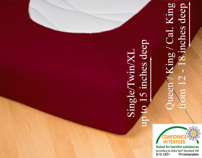 Fitted jersey knit stretch sheet in color 56-bordeaux, underside showing characteristic oval bottom-hugging mattress, deep pocket up to 18 in, OEKO-TEX certified – Egino.