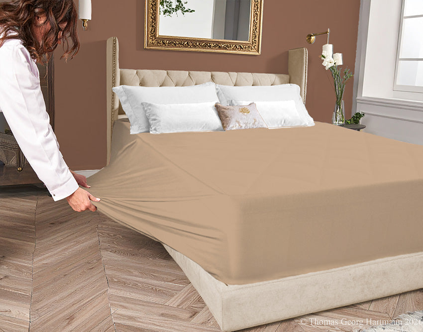 Chocolate Milk 96/4 jersey-knit fitted sheet on an extra-deep mattress—pulling the sidewall over a foot outward. This abundant stretch ensures an effortless change for those with limited mobility. Creates a feeling of coziness and security.