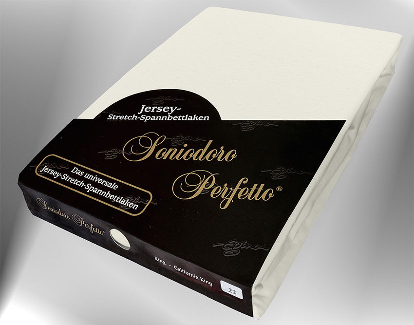 Jersey knit stretch sheet in cream color (EGINO, 22-cream), retail packaging under dim light.