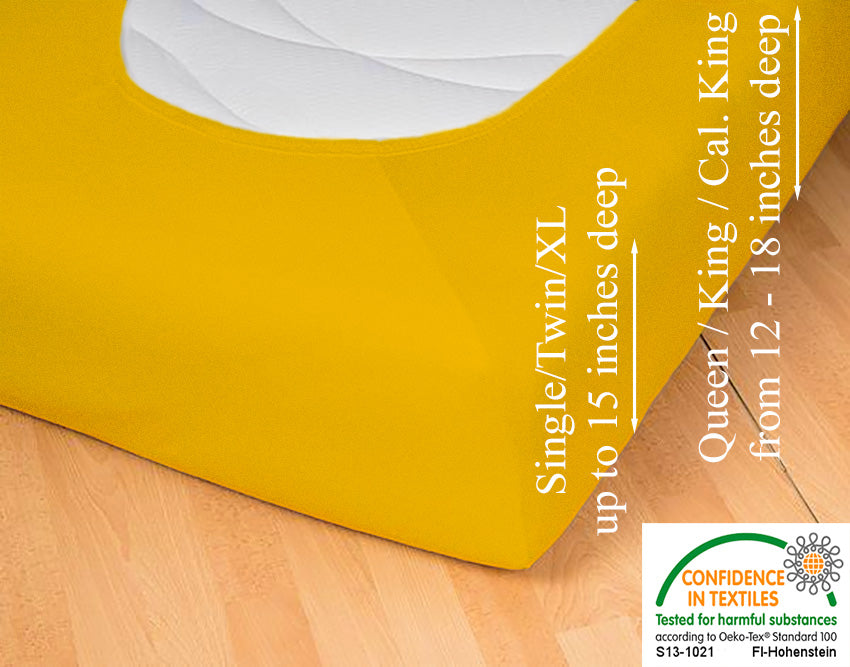 Fitted jersey knit stretch sheet in color 67-gold, underside showing characteristic oval bottom-hugging mattress, deep pocket up to 18 in, OEKO-TEX certified – Egino.
