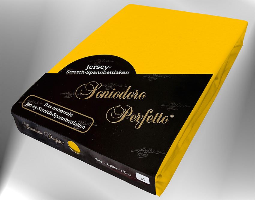 EGINO gold jersey knit stretch sheet (67-Gold) in retail packaging, under dim light.