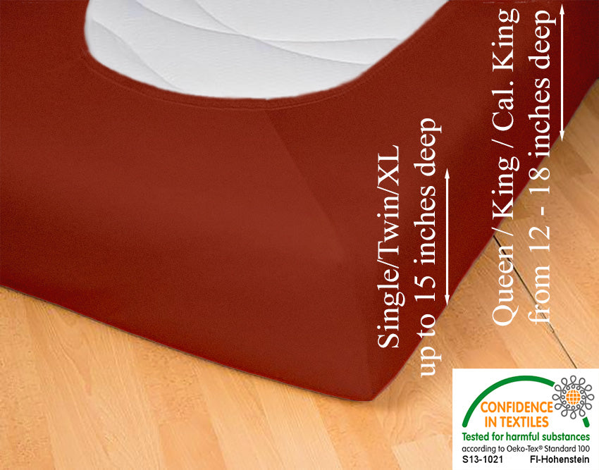 Fitted jersey knit stretch sheet in color 55-redwood, underside showing characteristic oval bottom-hugging mattress, deep pocket up to 18 in, OEKO-TEX certified – Egino.