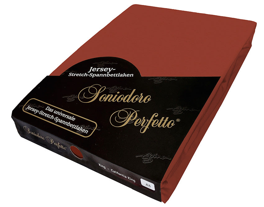 EGINO Redwood jersey-knit stretch sheet in original German packaging. A 96/4 wellness essential in a warm, natural reddish-brown that signifies friendliness, comfort, and protection—an inviting foundation for a restful bedroom.