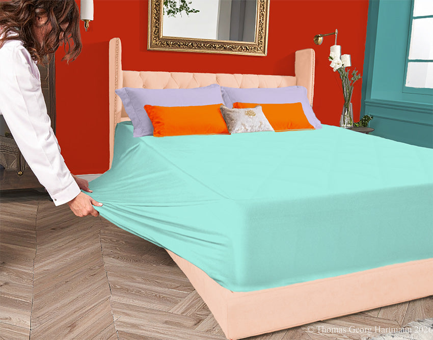 Mint 96/4 jersey-knit sheet on a deep mattress—pulling the sidewall over a foot outward. This abundant stretch ensures a quick, time-saving change. Pairs with apricot and coral for a breezy vacation vibe that evokes pure relaxation.