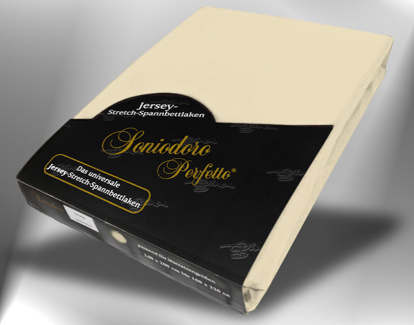 EGINO sand jersey knit stretch sheet (26-Sand) in retail packaging, under dim light
