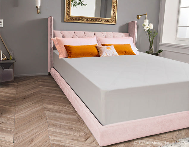 Wrinkle-free stretch jersey knit fitted sheet smoothly covering the extra deep Queen-size mattress for a luxury spa finish (silver).